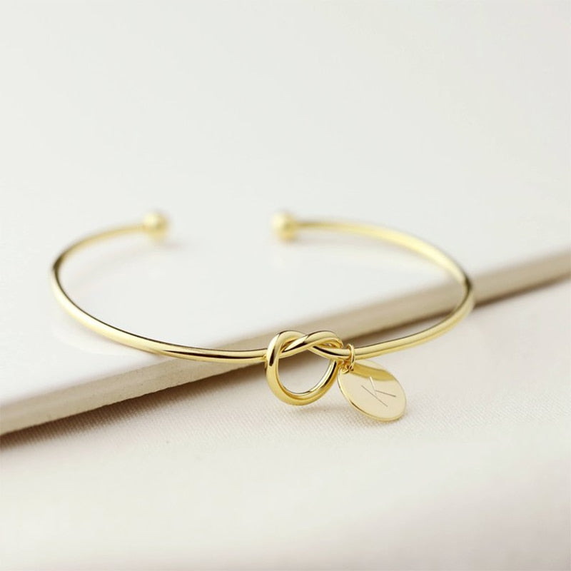 Rose gold / silver Charm bracelet / Knot Design